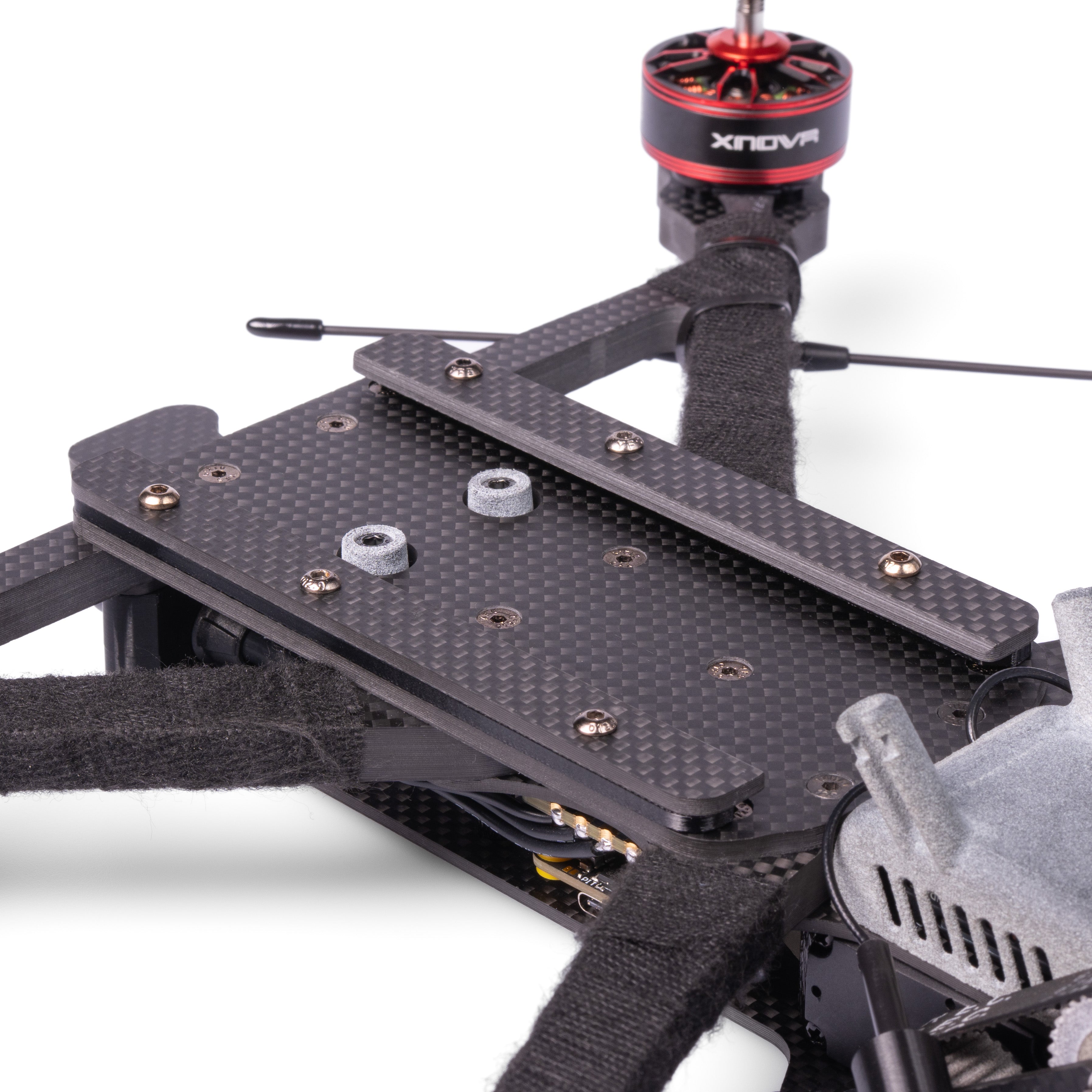 Close-up of a drone frame with visible branding on a white background