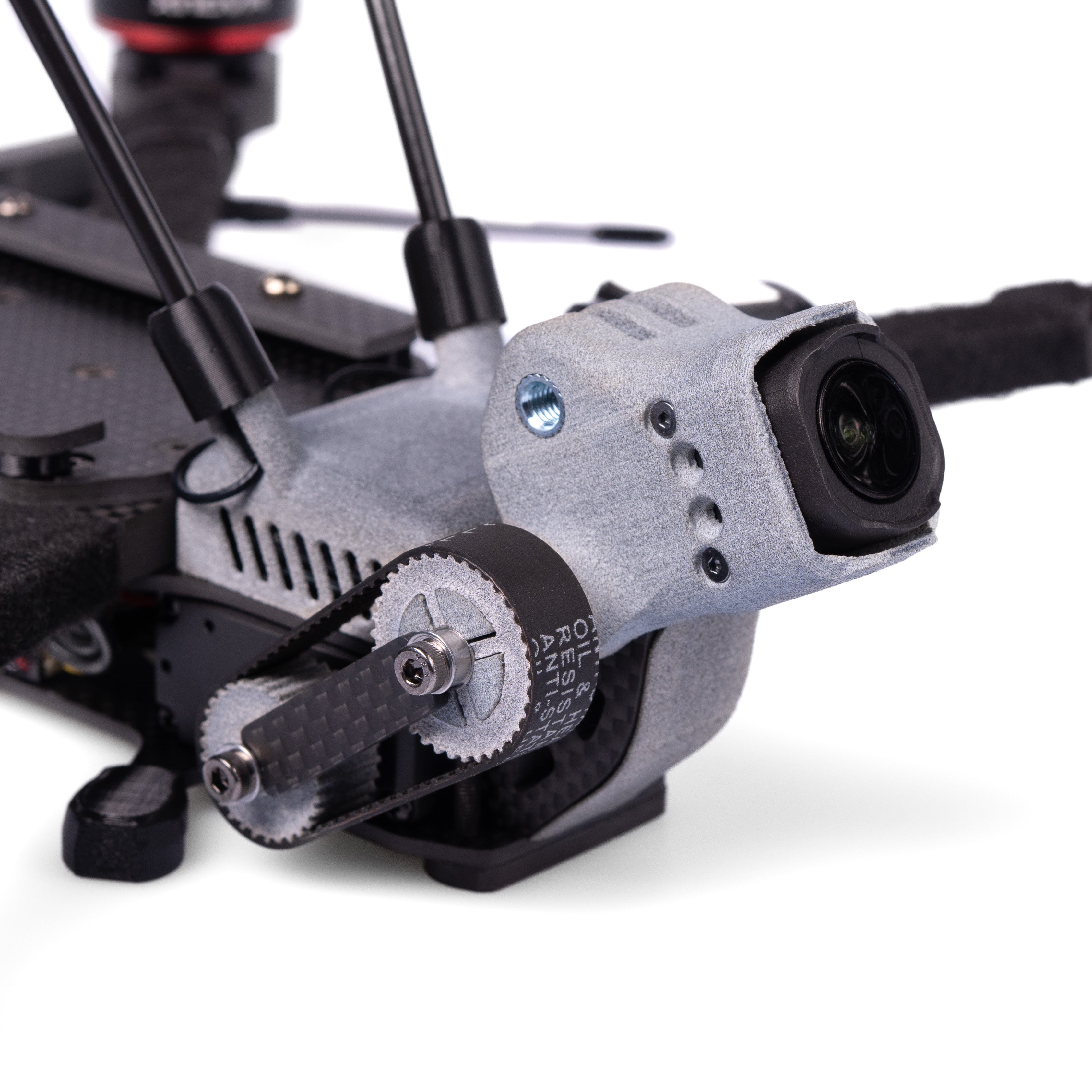 Close-up of a drone's camera and mechanical components on a white background